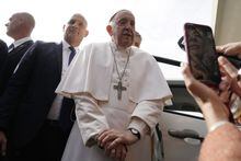 Pope Francis talks with journalists as he leaves the Agostino Gemelli University Hospital in Rome, Saturday, April 1, 2023 after receiving treatment for a bronchitis, The Vatican said. Francis was hospitalized on Wednesday after his public general audience in St. Peter's Square at The Vatican. (AP Photo/Gregorio Borgia)