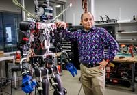 Schulich School of Engineering professor Alejandro Ramirez-Serrano leans on one of his robots at the University of Calgary’s Unmanned Vehicles Robotarium Lab in Calgary, Alta., Tuesday, June 14, 2022. THE CANADIAN PRESS/Jeff McIntosh