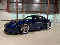 A custom-built Porsche 911 GT3 Touring with the black plastic exterior mirrors painted to match the body, a $750 option, because black plastic has no place in a $200,000 car