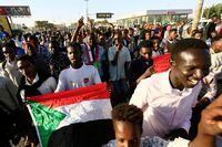 Sudanese civilians march during the first anniversary of the start of the uprising that toppled long-time ruler Omar al-Bashir, in Khartoum, Sudan, on Dec. 19, 2019.
