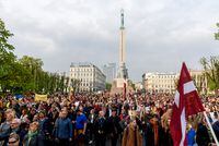 RIGA, LATVIA. 20th May 2022.  Crowd near Monument of Freedom. About 5000 persons participates ,during rally called "titled "Getting Rid of Soviet Heritage" in Riga city. March from Freedom Monument to the not-much-loved Soviet "Victory Monument".
