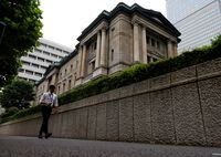 A man walks past Bank of Japan's headquarters in Tokyo, Japan, June 17, 2022. REUTERS/Kim Kyung-Hoon