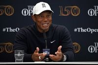 US golfer Tiger Woods attends a press conference held ahead of The 150th British Open Golf Championship on The Old Course at St Andrews in Scotland on July 12, 2022. (Photo by Paul ELLIS / AFP) / RESTRICTED TO EDITORIAL USE (Photo by PAUL ELLIS/AFP via Getty Images)