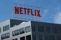 (FILES) In this file photo taken on March 02, 2022, the Netflix logo is displayed on top of their office building in Hollywood, California. - Netflix shares fell more than 30 percent early on April 20, 2022, after the streaming company reported a drop in subscribers for the first time in a decade. About 15 minutes into trading, shares were down 32.4 percent at $235.76 in the first session since the company's earnings report was released after the market closed on April 19. (Photo by Chris DELMAS / AFP) (Photo by CHRIS DELMAS/AFP via Getty Images)