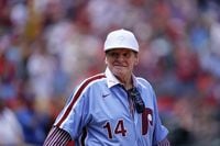 Former Philadelphia Phillies player Pete Rose walks onto the field for an alumni day event before a baseball game between the Phillies and the Washington Nationals, Sunday, Aug. 7, 2022, in Philadelphia. (AP Photo/Matt Rourke)