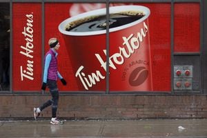 Signage for Tim Hortons is seen outside a Tim Hortons restaurant in Toronto on March 6, 2020.