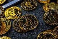 Bitcoin coins are seen at a stand during the Bitcoin Conference 2023, in Miami on May 19.