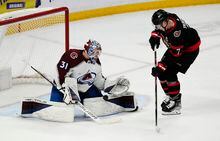 Colorado Avalanche goaltender Jonas Johansson makes a save in front of Ottawa Senators left wing Brady Tkachuk during third period NHL action, Thursday, March 16, 2023 in Ottawa.  THE CANADIAN PRESS/Adrian Wyld