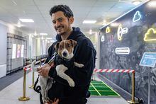 Actor and UNICEF Goodwill Ambassador Orlando Bloom holds Patron the Dog - a detection dog and mascot for the State Emergency Service of Ukraine in Kyiv, Ukraine March 25, 2023 in this handout image. UNICEF/Skyba/Handout via REUTERS THIS IMAGE HAS BEEN SUPPLIED BY A THIRD PARTY. MANDATORY CREDIT. NO RESALES. NO ARCHIVES.  TPX IMAGES OF THE DAY