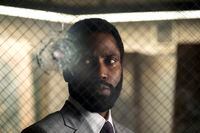 This image released by Warner Bros. Entertainment shows John David Washington in a scene from "Tenet." Warner Bros. says it is delaying the release of Christopher Nolan's sci-fi thriller Tenet until Aug. 12. (Melinda Sue Gordon/Warner Bros. Entertainment via AP)