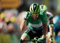 Cycling - Tour de France - Stage 13 - Nimes to Carcassonne - France - July 9, 2021 Deceuninck–Quick-Step rider Mark Cavendish of Britain wearing the green jersey celebrates as he crosses the line to win stage 13 REUTERS/Benoit Tessier