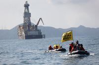 Greenpeace activists hold banners during a protest against the deep sea mining vessel Hidden Gem, commissioned by Canadian miner The Metals Company, in the Mexican Pacific port of Manzanillo, in Manzanillo, Mexico September 27, 2023. Gustavo Graf/Greenpeace Mexico/Handout via REUTERS THIS IMAGE HAS BEEN SUPPLIED BY A THIRD PARTY.
