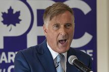 People's Party of Canada Leader Maxime Bernier responds to reporters' questions after launching his campaign during a press conference at a hotel in Saint-Georges, Que., Friday, Aug. 20, 2021. THE CANADIAN PRESS/Jacques Boissinot