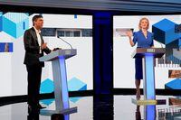 FILE PHOTO: Candidates Rishi Sunak and Liz Truss take part in the BBC Conservative party leadership debate at Victoria Hall in Hanley, Stoke-on-Trent, Britain, July 25, 2022. Jacob King/Pool via REUTERS