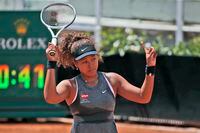 In this May 12, 2021, file photo, Naomi Osaka of Japan reacts after losing a point against Jessica Pegula of the United States during their match at the Italian Open tennis tournament, in Rome.