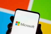 FILE PHOTO: Smartphone is seen in front of Microsoft logo displayed in this illustration taken, July 26, 2021. REUTERS/Dado Ruvic/Illustration