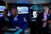 Traders work on the floor of the New York Stock Exchange (NYSE) on Oct. 20.