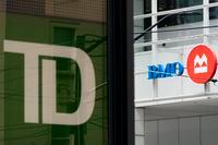 Toronto-Dominion Bank and Bank of Montreal (BMO) signages is seen in the Financial District of Toronto, Monday, Aug. 14, 2023. THE CANADIAN PRESS/Spencer Colby