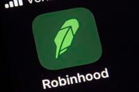 this Dec. 17, 2020, file photo shows the logo for the Robinhood app on a smartphone in New York.