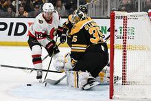 BOSTON, MASSACHUSETTS - MARCH 21: Goaltender Linus Ullmark #35 of the Boston Bruins makes a save on shot by Alex DeBrincat #12 of the Ottawa Senators during the second period at the TD Garden on March 21, 2023 in Boston, Massachusetts. (Photo by Brian Fluharty/Getty Images)