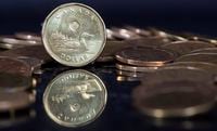 The Canadian dollar coin, the Loonie, is displayed Friday, January 30, 2015 in Montreal. A new survey suggests one in three Canadians are pessimistic about the future of their finances and one in four are extremely concerned about being able to afford basic needs.THE CANADIAN PRESS/Paul Chiasson