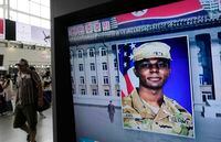 FILE - A TV screen shows a file image of American soldier Travis King during a news program at the Seoul Railway Station in Seoul, South Korea on Aug. 16, 2023. The American soldier who sprinted into North Korea across the heavily fortified border between the Koreas two months ago arrived back in the U.S. early Thursday, Sept. 28, video appeared to show. (AP Photo/Ahn Young-joon, File)