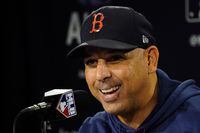 Boston Red Sox manager Alex Cora speaks to reporters prior to a baseball practice at Fenway Park, Sunday, Oct. 17, 2021, in Boston, Mass. (AP Photo/Robert F. Bukaty)