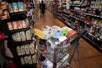 A shopping cart is seen in a supermarket in Manhattan, New York City, U.S., June 10, 2022.