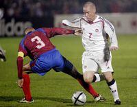 Canada's Iain Hume (7) tries to get the ball around Costa Rica's Luis Marin during first half of World Cup qualifying soccer competition at Swangard Staduim in Burnaby, B.C. Wednesday October 13, 2004.(CP PHOTO/Chuck Stoody)