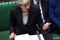 A handout photograph released by the U.K. Parliament on March 20, 2019, shows British Prime Minister Theresa May speaking during the weekly Prime Minister's Questions (PMQs) question and answer session in the House of Commons in London on March 20, 2019.