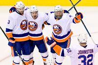New York Islanders centre Jean-Gabriel Pageau (44) celebrates his goal with teammates Adam Pelech (3), Leo Komarov (47) and Ross Johnston (32) during third period NHL Stanley Cup Eastern Conference playoff hockey action against the Philadelphia Flyers, in Toronto, Monday, Aug. 24, 2020.