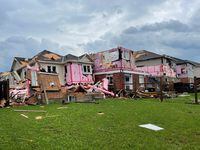 General view of damaged houses in the aftermath of a possible tornado in Barrie, Ontario, Canada July 15, 2021, in this picture obtained from social media. BRANDON VIEIRA via REUTERS THIS IMAGE HAS BEEN SUPPLIED BY A THIRD PARTY. MANDATORY CREDIT. NO RESALES. NO ARCHIVES.