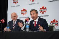 Canada Soccer president Nick Bontis, right, speaks as interim general secretary Earl Cochrane listens during a news conference, in Vancouver on Sunday, June 5, 2022.&nbsp; THE CANADIAN PRESS/Darryl Dyck
