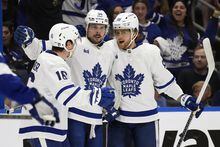 Toronto Maple Leafs center Auston Matthews (34) celebrates his goal against the Tampa Bay Lightning with right wing William Nylander (88) and right wing Mitchell Marner (16) during the third period in Game 4 of an NHL hockey Stanley Cup first-round playoff series Monday, April 24, 2023, in Tampa, Fla. (AP Photo/Chris O'Meara)