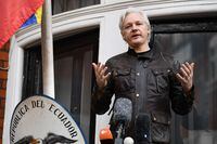 (FILES) In this file photo taken on May 19, 2017 Wikileaks founder Julian Assange speaks on the balcony of the Embassy of Ecuador in London. - WikiLeaks founder Julian Assange fathered two children with one of his lawyers while holed up in Ecuador's embassy in London for much of the past decade, according to a report Sunday, April 12, confirmed by the kids' mother. (Photo by Justin TALLIS / AFP) (Photo by JUSTIN TALLIS/AFP via Getty Images)