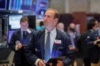 Traders work on the floor at the New York Stock Exchange (NYSE) in New York, U.S., October 21, 2019. REUTERS/Brendan McDermid