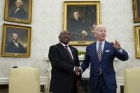 President Joe Biden shakes hands with South African President Cyril Ramaphosa as they meet in the Oval Office of the White House, Friday, Sept. 16, 2022, in Washington. (AP Photo/Alex Brandon)