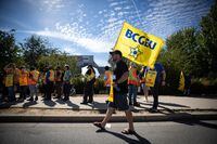Members of the British Columbia General Employees' Union picket outside a B.C. Liquor Distribution Branch facility, in Delta, B.C., on Monday, Aug. 15, 2022. THE CANADIAN PRESS/Darryl Dyck