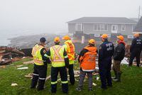 Search and rescue crews overlook the coastline in the aftermath of Hurricane Fiona in Port Aux Basques, Newfoundland, Canada, September 27, 2022. REUTERS/John Morris