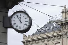 Five to twelve "fuenf vor zwoelf" is written on a clock next to a logo of the Swiss bank Credit Suisse, in Zurich, Switzerland, Monday, March 20, 2023. Shares of Credit Suisse plunged 60.5% on Monday after banking giant UBS said it would buy its troubled Swiss rival for almost $3.25 billion in a deal orchestrated by regulators to try to stave off further turmoil in the global banking system. (Ennio Leanza/Keystone via AP)