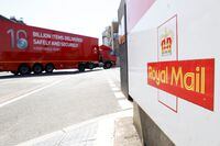 FILE PHOTO: The logo of Royal Mail is seen outside the Mount Pleasant Sorting Office as a delivery vehicle arrives, in London, Britain, June 25, 2020. REUTERS/John Sibley