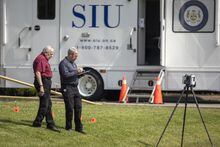 Members of the Special Investigations Unit (SIU) at the scene of a homicide investigation in the area of Jones Road and Barton Street in Hamilton, Ont. Sunday, May 28, 2023. Ontario's police watchdog says five firearms were collected from the Hamilton home where police allege a 57-year-old landlord killed two tenants before he was fatally shot by police. THE CANADIAN PRESS/Nick Iwanyshyn