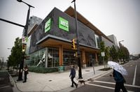 People walk past the flagship MEC (Mountain Equipment Co-op) store in Vancouver, on Monday, September 14, 2020. Darryl Dyck/The Globe and Mail