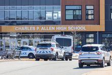 Police monitor the situation at Charles P. Allen High School in Halifax, Monday, March 20, 2023. Halifax police have arrested a student after three people were stabbed at a high school this morning. THE CANADIAN PRESS/Riley Smith