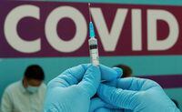 FILE PHOTO: FILE PHOTO: A healthcare worker prepares a dose of Sputnik V (Gam-COVID-Vac) vaccine against the coronavirus disease (COVID-19) at a vaccination centre in Gostiny Dvor in Moscow, Russia July 6, 2021. REUTERS/Tatyana Makeyeva/File Photo