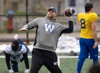 Winnipeg Blue Bombers head coach Mike O’Shea throws a football during practice in Hamilton, Ont., Friday, Dec. 10, 2021. Winnipeg will meet the Hamilton Tiger-Cats in the 108th CFL Grey Cup game.THE CANADIAN PRESS/Ryan Remiorz