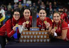Team Canada skip Kerri Einarson, from left to right, third Val Sweeting, second Shannon Birchard and lead Briane Harris pose with their gold medals and the trophy after defeating Manitoba in the final at the Scotties Tournament of Hearts, in Kamloops, B.C., on Sunday, February 26, 2023. THE CANADIAN PRESS/Darryl Dyck