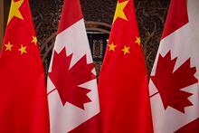 (FILES) In this file photo taken on December 5, 2017, shows Canadian and Chinese flags taken prior to a meeting with Canada's Prime Minister Justin Trudeau and China's President Xi Jinping at the Diaoyutai State Guesthouse in Beijing. - China on July 4, 2020, accused Canada of meddling after Ottawa said it was suspending its extradition treaty with Hong Kong to protest a tough new national security law imposed there by Beijing. (Photo by Fred DUFOUR / POOL / AFP) (Photo by FRED DUFOUR/POOL/AFP via Getty Images)