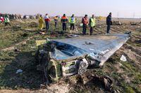 In this file photo taken on Jan. 8, 2020, rescue teams are seen at the scene of a crashed Ukrainian airliner, in Tehran.