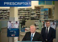 Ontario Premier Doug Ford listens to a question from a reporter following a press conference at a Shoppers Drug Mart pharmacy in Etobicoke, Ont., on Wednesday, January 11, 2023.  THE CANADIAN PRESS/ Tijana Martin 